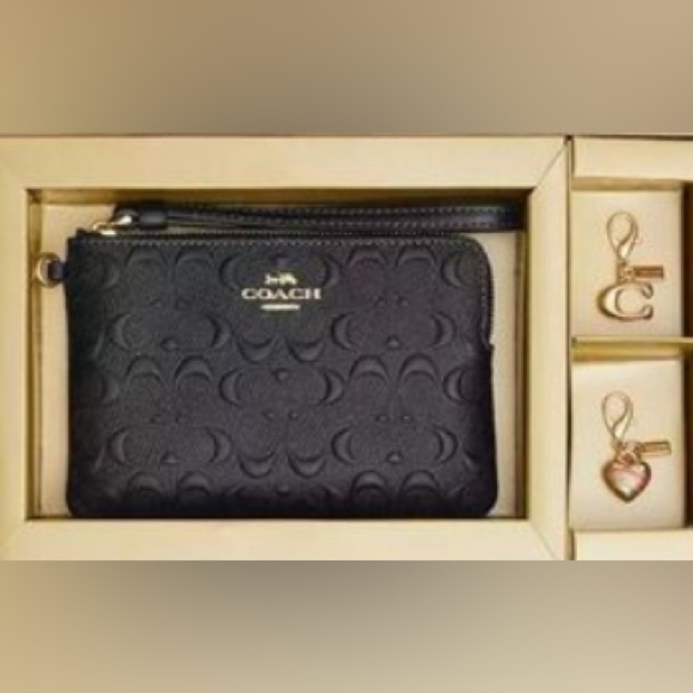 Brand new coach wallet in original box with charms
